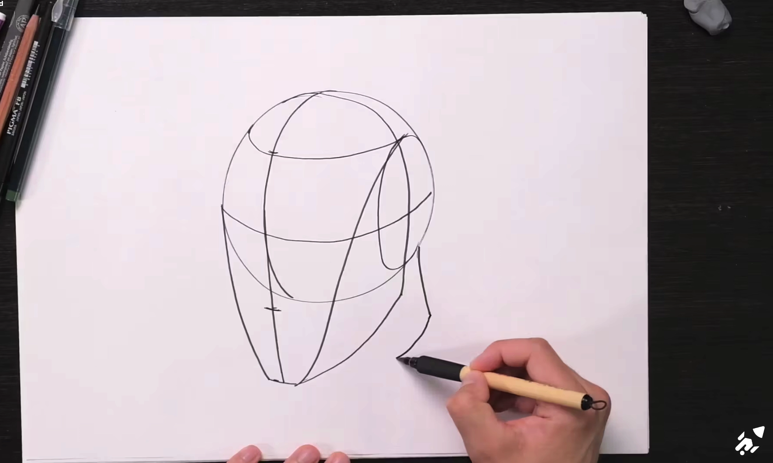 Dessine une tête simplifiée selon la méthode Loomis.